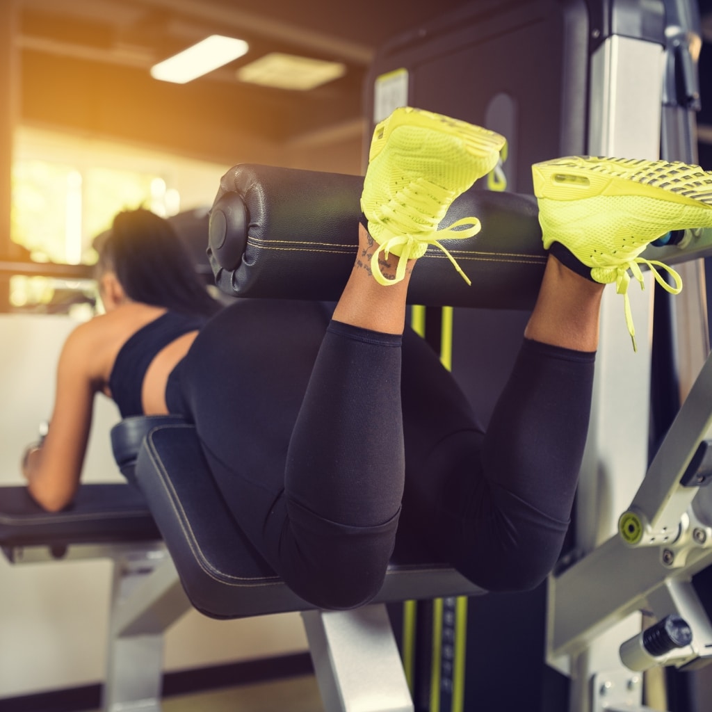 Man performing hamstring exercises with resistance bands - strengthening exercises for hamstring muscles