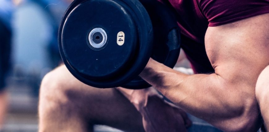 Man looking concerned at his increased body fat while trying to bulk up during his fitness journey